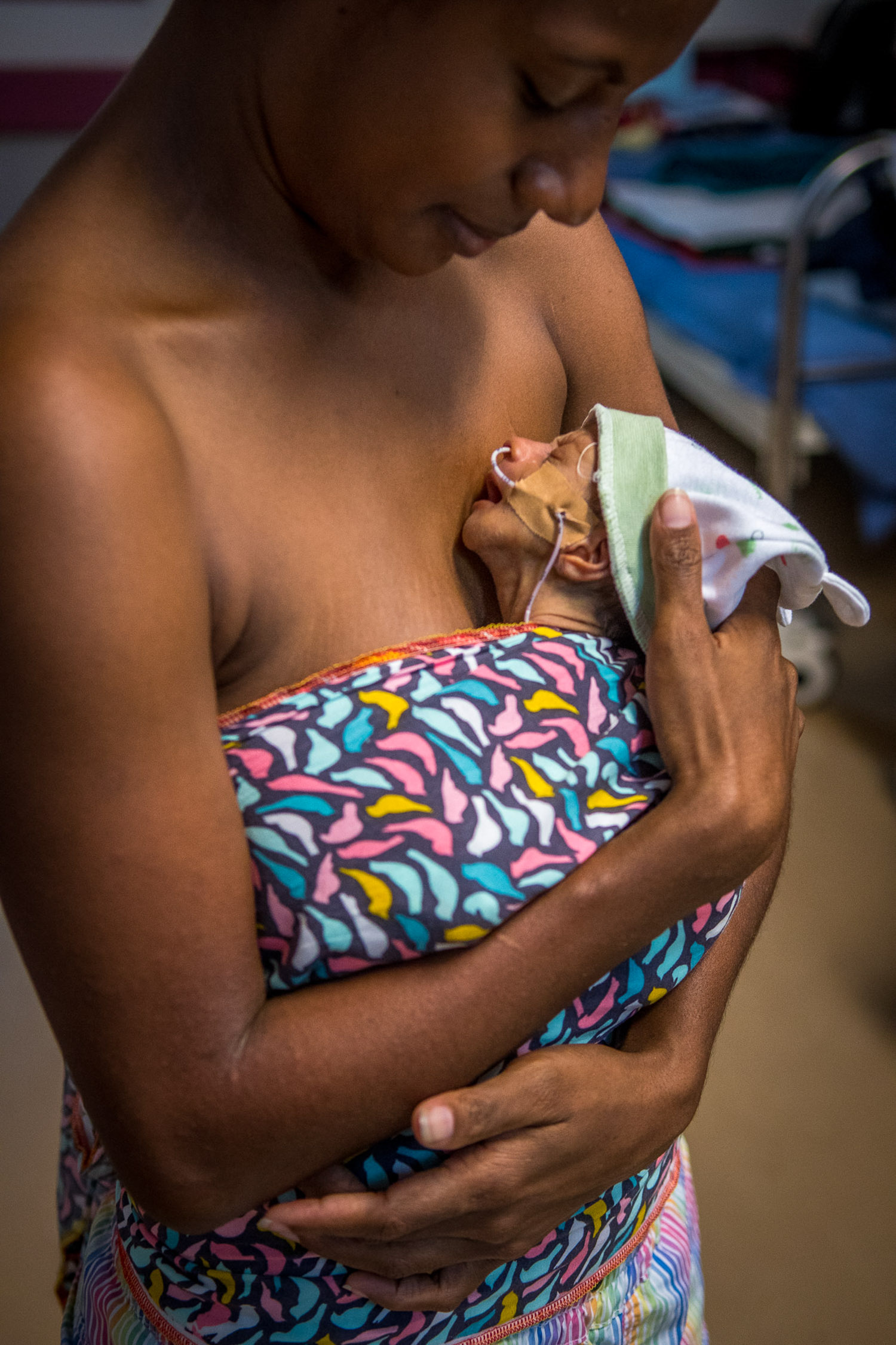 Port Moresby General Hospital. Mother performing skin to skin and kangaroo mother care for their new born babies. Neonatal mortality contributes significantly to deaths in children under five years.