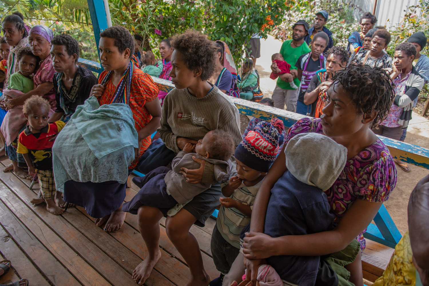 Susu Mama’s clinic in Goroka. Group of mother and children waiting to be attended. Children has been receiving immunization and medical attention.